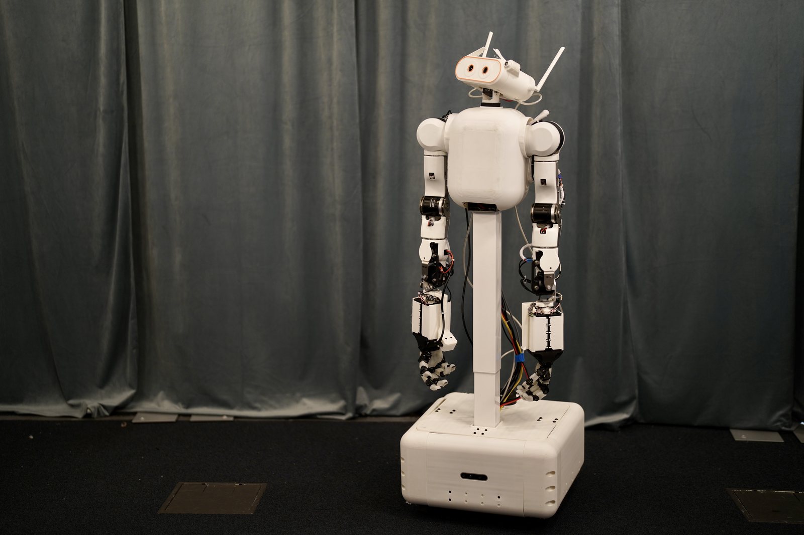 MABEL v1.0, as built — white shells, twin ORCA hands, swerve base